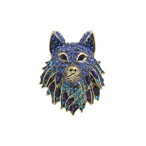 Vintage animal totem wolf head brooch encrusted with vibrant blue and purple rhinestones.