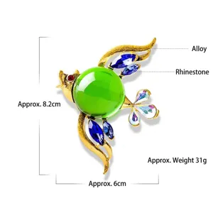 Colorful bird brooch with large green jelly stone and blue rhinestones in gold alloy