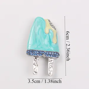 Close-up detail of a creative blue popsicle enamel brooch showing dimensions 6cm by 3.5cm