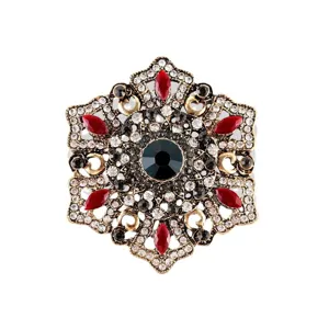 Exquisito broche de estilo barroco vintage con diamantes de imitación rojos y verdes.