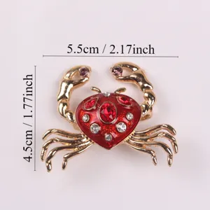 Detailed view of crab brooch with red enamel and rhinestones, dimensions shown