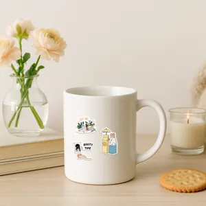 Detailed view of self-care stickers applied to a clean white ceramic mug