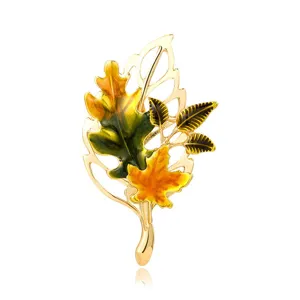Elegant vintage maple leaf brooch with colorful enamel coating on gold-plated alloy base