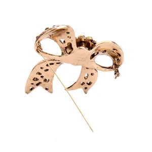 Detailed back view of vintage gold bow brooch showing pin and clasp mechanism