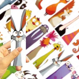 Hand holding a funny cartoon rabbit bookmark from a 30-piece animal stationery set