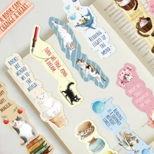Close-up of assorted cute cat shaped bookmarks featuring inspirational reading quotes
