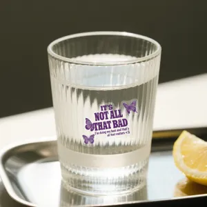 Detailed shot of a purple transparent inspirational PET sticker on a glass cup