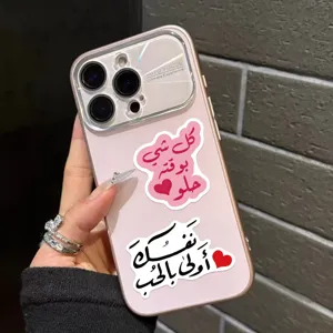 Close-up of inspirational Arabic graffiti stickers with heart designs on a phone case