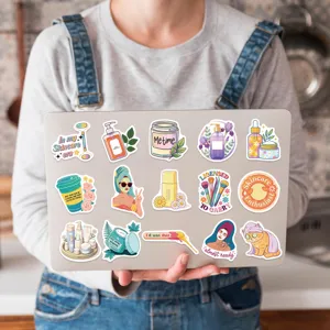 Vibrant cartoon skincare and beauty stickers decorated on a laptop lid surface