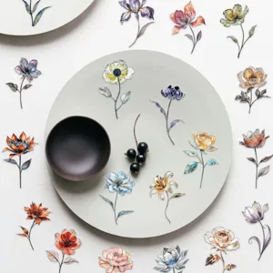 Detailed view of elegant silver foil watercolor floral PET stickers on a decorative plate
