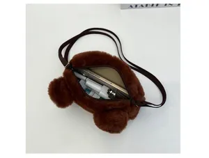 Detailed view of brown plush bear crossbody bag interior with phone and cosmetic items