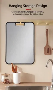 Detail view of a hanging titanium cutting board in a clean modern kitchen setting