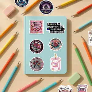 Assorted Bookish stickers with holographic star film on a blue journal diary