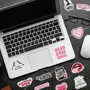 Collection of waterproof bookish reading stickers with glitter film on a laptop