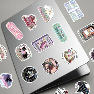 Detailed close-up of bookish reading stickers with holographic star film on laptop
