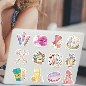 Detailed shot of various colorful cartoon skincare and beauty stickers on a laptop
