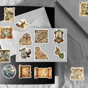 Detail view of vintage map stickers with compass and nautical scroll designs.