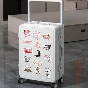 Detailed view of aesthetic Bookish stickers on a white suitcase for laptop and DIY décor