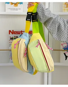 Detail view of colorful macaron-style crossbody chest bags featuring braided zipper pulls