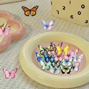 Close-up of fifty colorful PET waterproof butterfly stickers in a cream decorative tray
