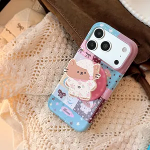 Close-up of cute cartoon cat patchwork iPhone case with matching pop grip