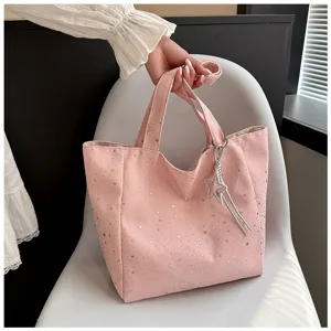 Fashionable pink large capacity tote bag featuring silver star patterns and charm