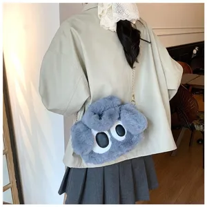 Lindo bolso bandolera de peluche de monstruo gris azulado con grandes ojos de dibujo