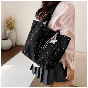 Korean style black star pattern tote bag with decorative silver star charm on shoulder