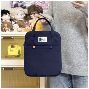 Élégant sac à main bleu marine pour ordinateur avec étiquette Rorks et boutons colorés