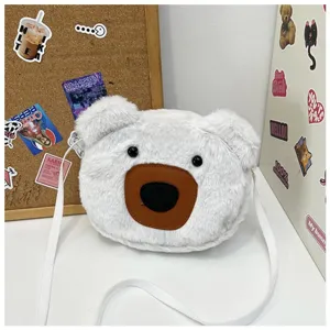 Close-up of cute white plush bear crossbody shoulder bag with soft fur texture