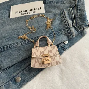 Elegant mini crossbody bag accessory with M-pattern monogram and golden chain strap