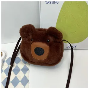 Detailed view of a brown plush bear crossbody bag with soft fur and adjustable strap