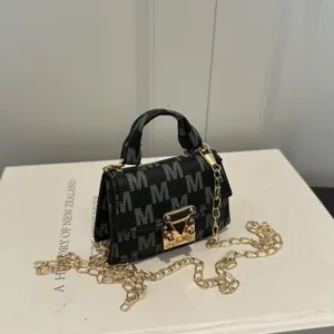 Mini luxury monogram crossbody bag with grey 'M' pattern and gold-tone chain strap