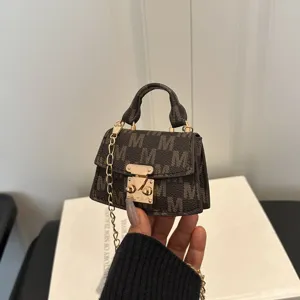 Luxury mini brown monogram crossbody bag with gold chain strap and elegant top handle