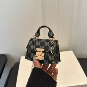 High-end luxury mini black crossbody bag with white M-pattern and gold chain strap