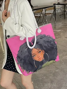 Vista detallada del bolso rosa con la ilustración de una chica negra con estilo afro.