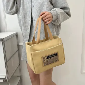 Casual yellow canvas handbag for commuting, portable lunch box bag for women and students