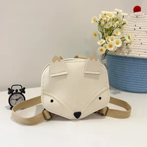 Close-up view of a cute white fox-themed kids backpack with durable canvas straps