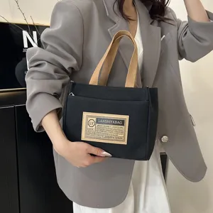 Minimalist Japanese style black canvas tote bag for commuting and casual daily use