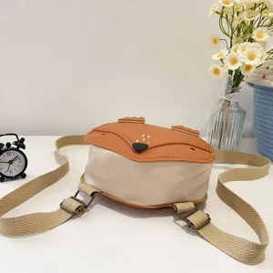 Close-up of a cute fox-themed children's backpack with adjustable beige straps for travel.