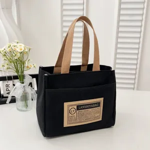 Minimalist Japanese style black canvas tote bag perfect for lunch or daily commute