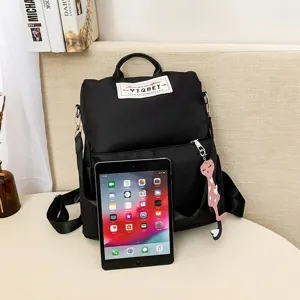 Multifunctionele zwarte Oxford rugzak voor dames met tablet voor maatvergelijking