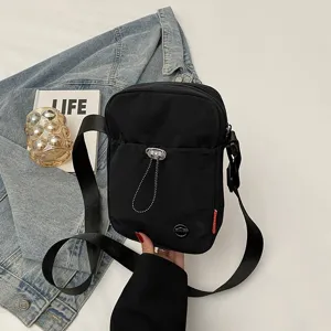 Minimalistische zwarte nylon crossbody telefoontas met trekkoordsluiting voor meisjes