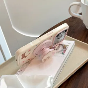 Primo piano della custodia per iPhone con cane e supporto magnetico rosa cipria.