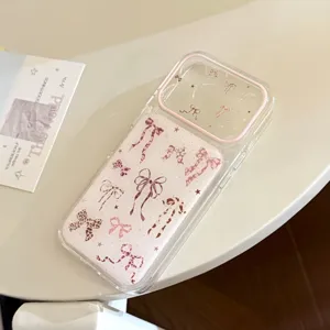 Macro detail view of pink leopard print bow patterns on a clear protective iPhone case