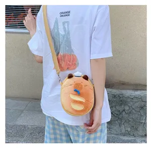 Detail showing the cute Capybara plush crossbody bag worn by a person outdoors