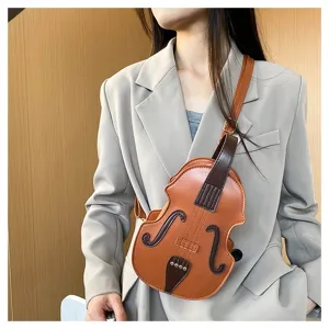 Close-up of trendy violin-shaped crossbody bag in brown faux leather worn by a model