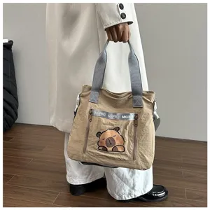 Cute cartoon capybara print tote bag for students, large capacity khaki shoulder bag detail