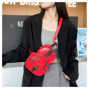 Stylish red violin-shaped crossbody bag shown worn by a model in a casual setting.