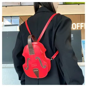 Creative red violin-shaped mini backpack shown on a model in a coffee shop setting